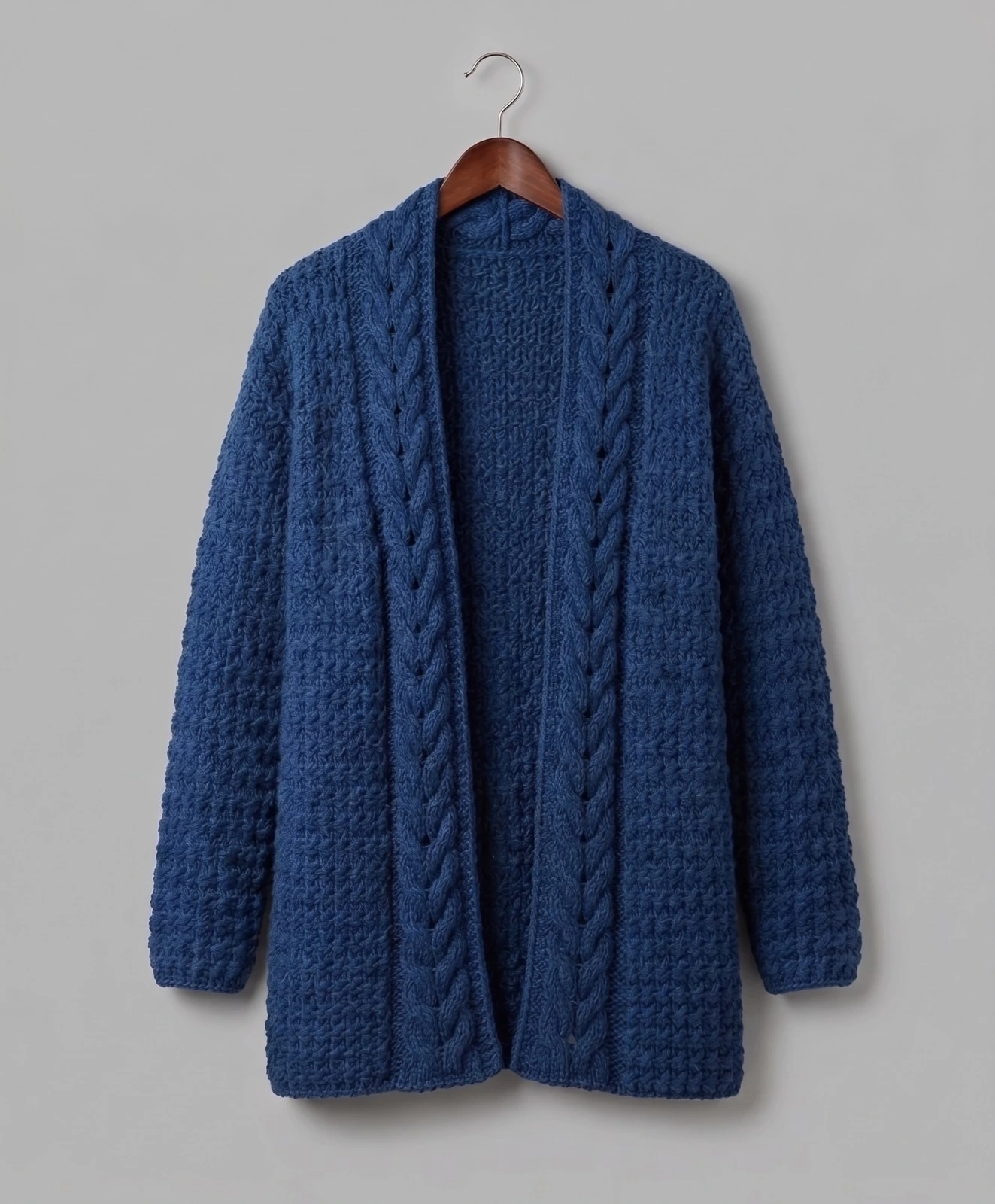 Close up of crochet cable collar on open front cardigan