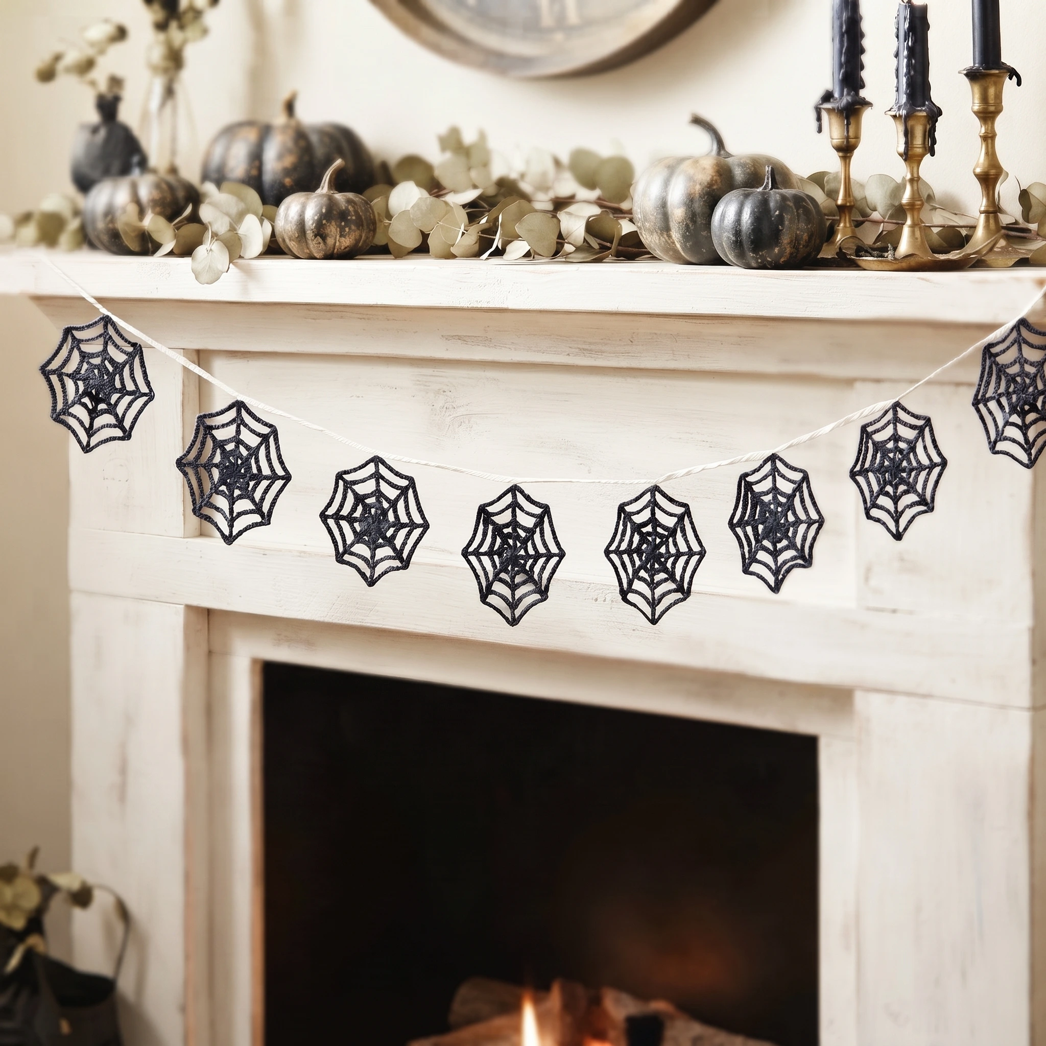 Crochet spider web garland hanging at a fire place