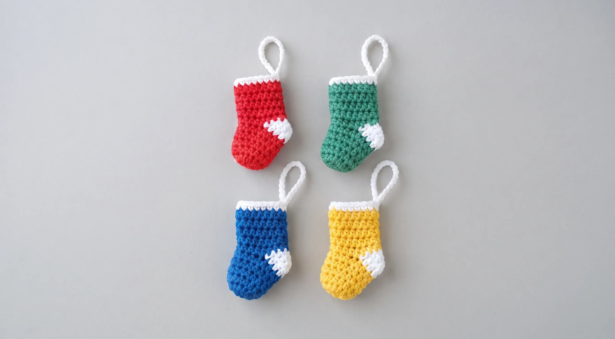 Mini red crochet Christmas stocking with white trim